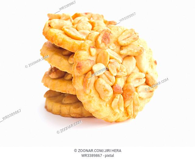 Sweet cookies with peanuts isolated on white background