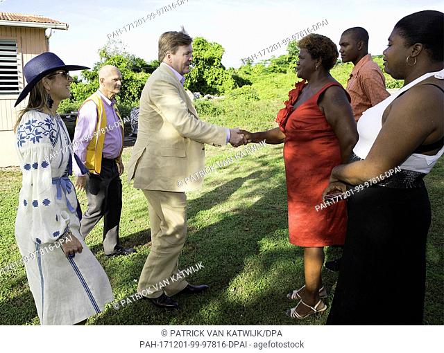 King Willem-Alexander and Queen MÃ¡xima of The Netherlands visit the 1st house that is repaired with the help of Dutch support at Sint Eustatius, on November 30