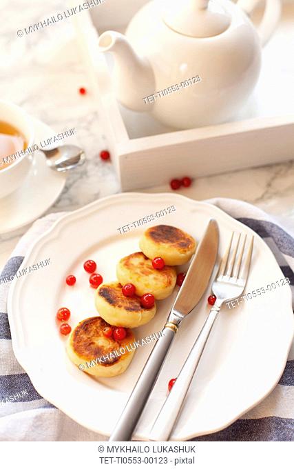 Syrniki with cranberries