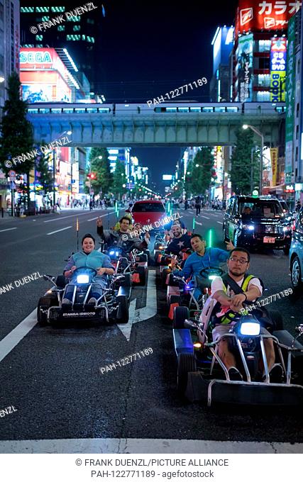Go-karts that resemble Mario Karts, but may not be called Mario Karts, on a street in Akihabara, in May 2019. | usage worldwide. - Tokyo/Tokyo/Japan