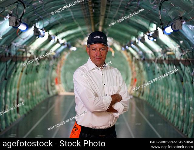 24 August 2022, Hamburg: André Walter, Managing Director of Airbus Aerostructures GmbH, stands in an A320 aircraft fuselage in hangar 260 on the Airbus site in...