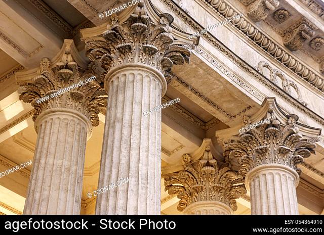 Vintage Old Justice Courthouse Column. Stone column ancient classic architecture detail. Abstract view of neoclassical fluted columns bases and steps of Court...