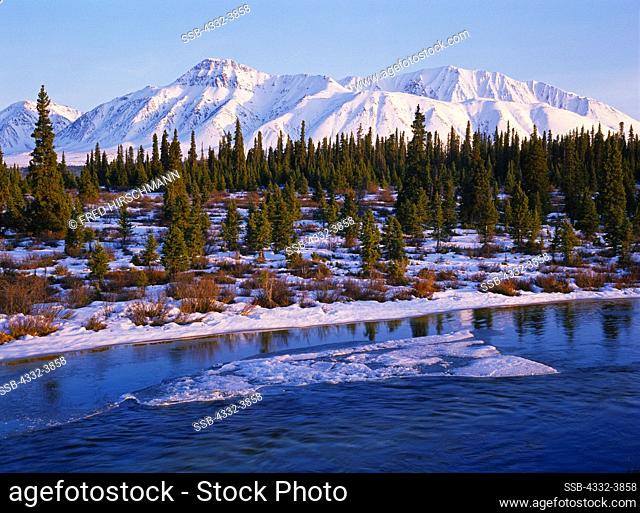 Canada, Yukon Territory, Ice on Jarvis Creek, Saint Elias Mountains beyond