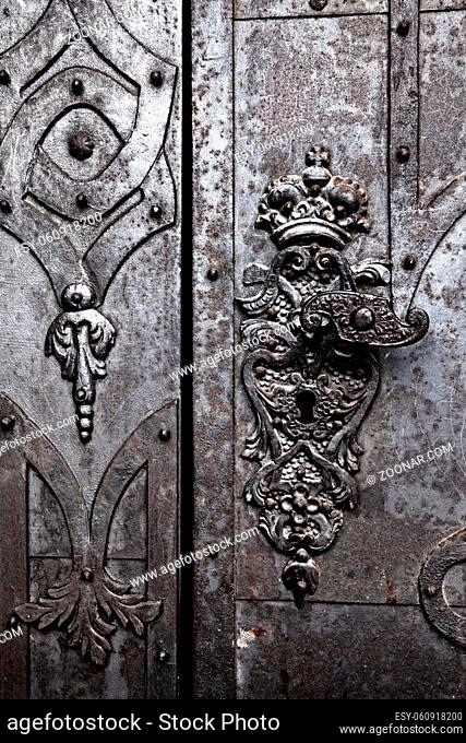 Detail of an old metal monastery door in Broumov, Czechia, Europe