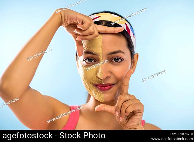 Young woman wearing a facial mask