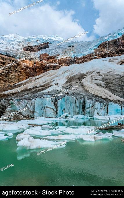 08 December 2022, Peru, Ancash: Ice floats in a lagoon that was recently formed in the Paccharuri Gorge. Known by residents of the area as the ""Frozen Lagoon""