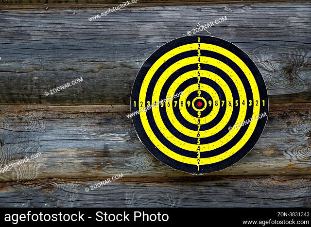 Crossaired target is with holes hanging on wall
