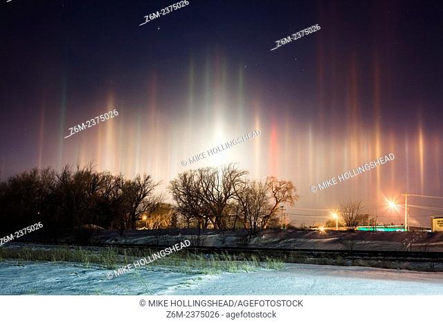 Arctic air combines with river steam and a corn milling plant's steam to produce light pillars over Blair Nebraska, thanks to ice crystals floating in the air...