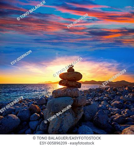 Ibiza Cap des Falco sunset with desire stones at the beach in Sant Josep Balearic Islands