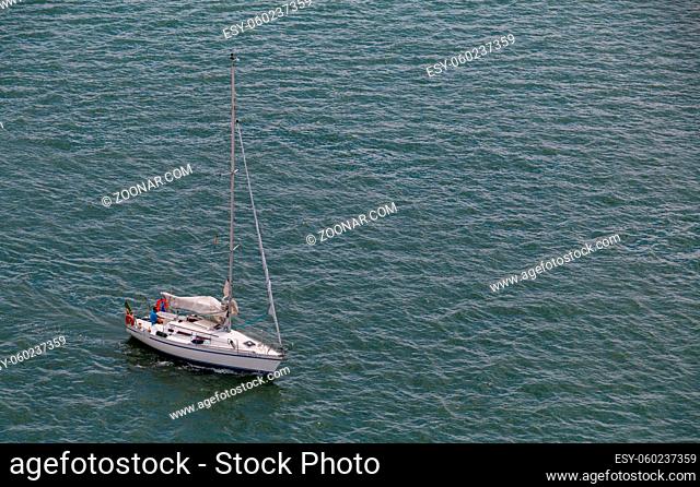 A picture of a sailboat sailing in the Tagus Tejo River