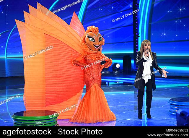 Red fish and the italian tv host Milly Carlucci during the tv broadcast Il Cantante Mascherato at Rai Audit?orium of the Foro Italico