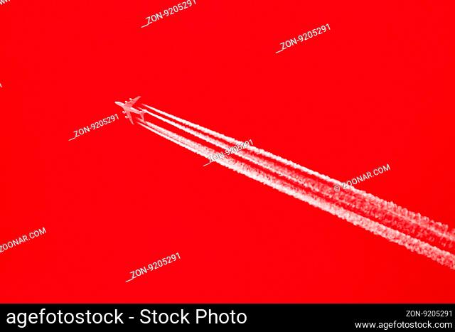 Large aircraft flying in sky, 4 stripes in the sky - Bright red sky