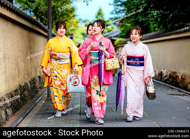 Kyoto, Japan - May 14 2019: Young lady in a kimono in the streets of Kyoto on a warm spring day in Japan