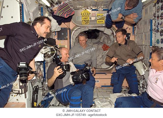 STS-115 and Expedition 13 crewmembers enjoy a light moment in the Unity node of the International Space Station while Space Shuttle Atlantis was docked with the...