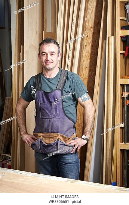 Carpenter smiling in workshop