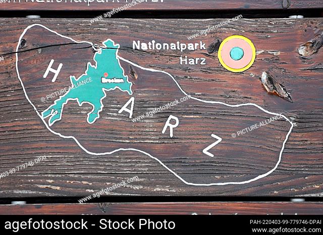 03 April 2022, Saxony-Anhalt, Ilsenburg: View of an information board with the outlines of the Harz National Park. The excursion destination at Scharfenstein...