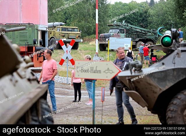 23 July 2022, Saxony-Anhalt, Benneckenstein: Visitors view historic military technology from various decades at the East German Vehicle and Technology Museum
