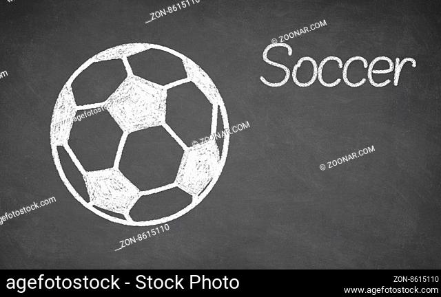 Soccer ball drawn on chalkboard. White chalk and balckboard