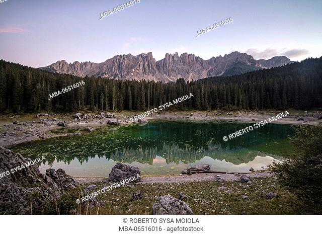 Latemar mountain range and woods are reflected in Lake Carezza Ega Valley Province of Bolzano South Tyrol Italy Europe