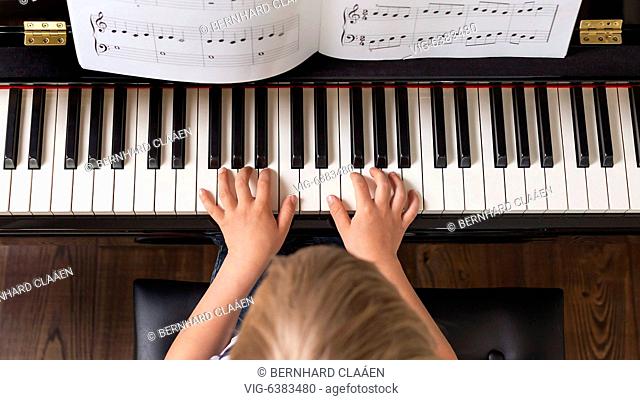 Boy, 4 years, playing piano, GERMANY, 07.05.2019. - Hamburg, , Germany, 07/05/2019
