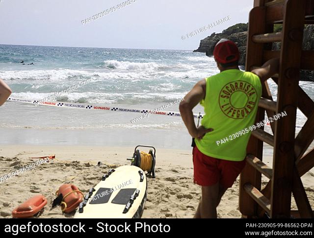 05 September 2023, Spain, Manacor: Lifeguard in Cala Anguia on a day with swell. Two bodies were found on the east coast of Mallorca