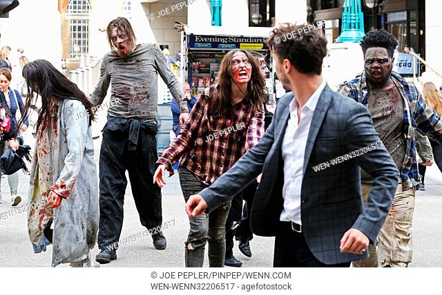 ‘Zombies’ appear in a gory billboard in Shoreditch, London, to mark the arrival of two new The Walking Dead scare mazes at THORPE PARK Resort for its annual...