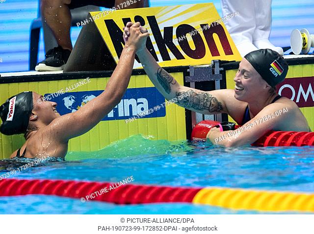 23 July 2019, South Korea, Gwangju: Swimming World Championship: 1500 meters freestyle women's final: Sarah Köhler (r) from Germany cheers with the winner...