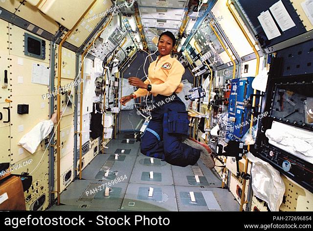 Astronaut Mae C. Jemison, mission specialist, appears to be clicking her heels in zero-gravity in this 35mm frame photographed in the science module aboard the...