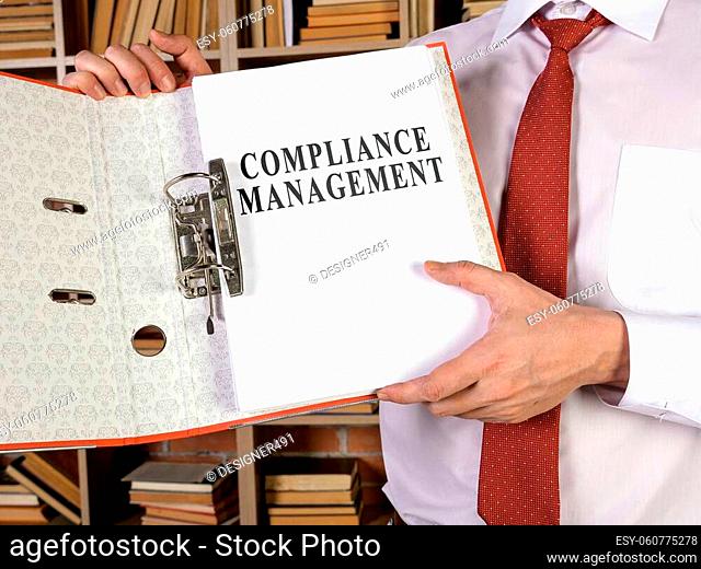 Manager shows folder with compliance management documents