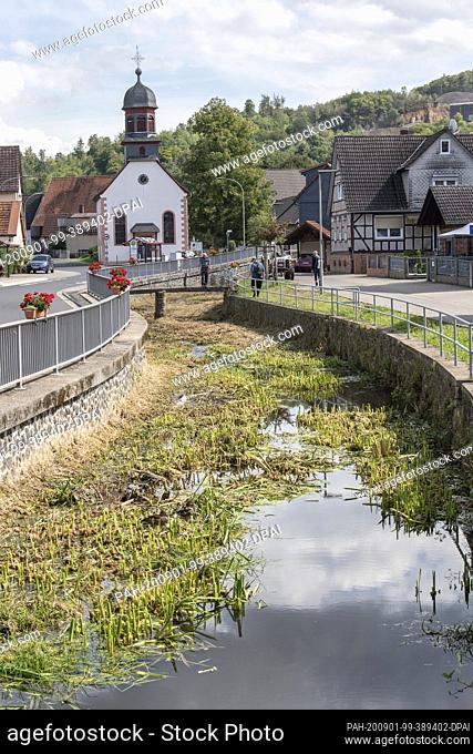 01 September 2020, Hessen, Bergheim: The little river ""Bleiche"" flows through the centre of Bergheim near Ortenberg in the Wetterau