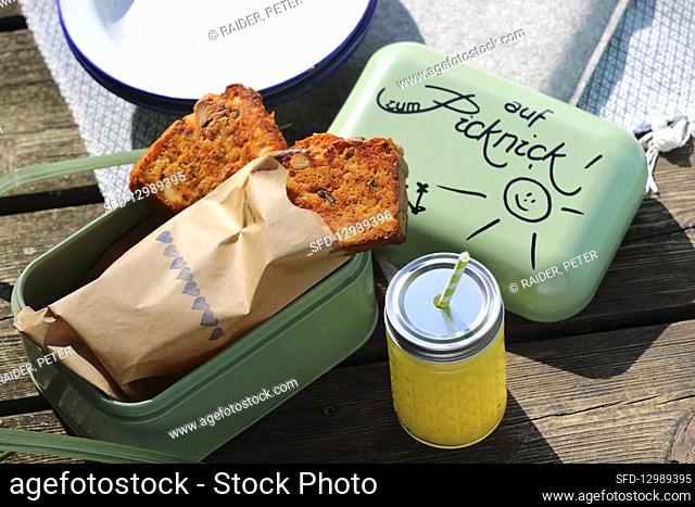 Tuna fish cake in a lunch box for a picnic by a lake