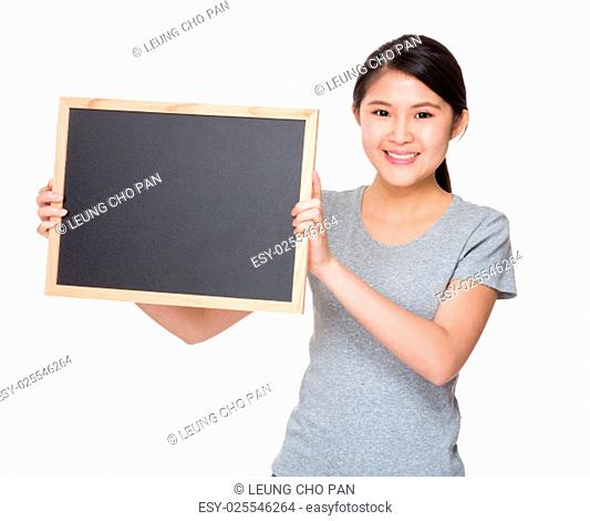 Young student hold with black board