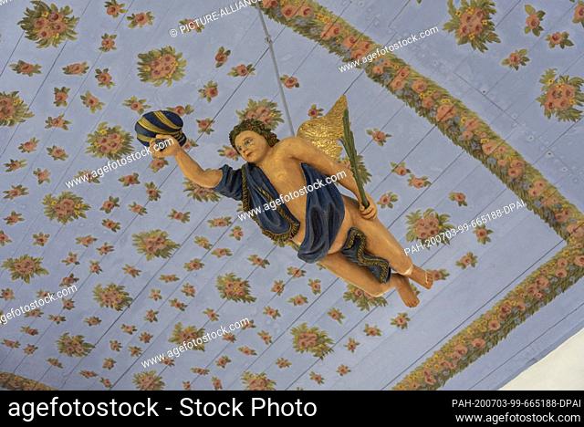 05 June 2020, Mecklenburg-Western Pomerania, Hiddensee: View into the interior of the island church in Kloster. From the ceiling painted with floral motifs...