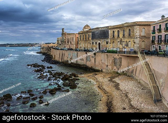 View on buildings and walls of Ortygia island, historical part of Syracuse city, southeast corner of the island of Sicily, Italy