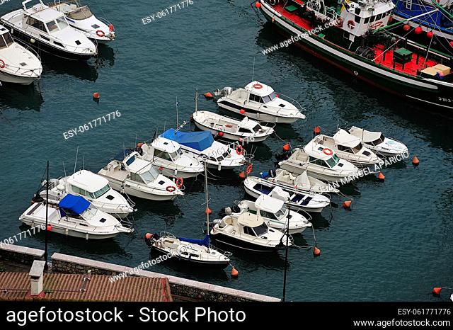 Small pleasure boats moored in the port of Elanchove on the coast of Vizcaya, Spain