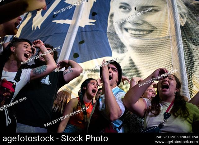 19 November 2023, Argentina, Buenos Aires: Supporters of Economy Minister Massa react in front of the C Complejo de Arte after the results of Argentina's...