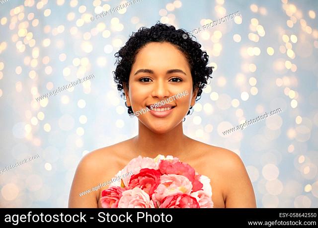 portrait of african american woman with flowers