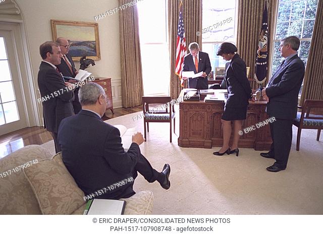 United States President George W. Bush meets with White House staff shortly before meeting with the United Nations Secretary General Kofi Annan Nov