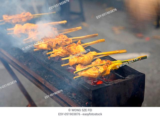 Malaysian traditional dishes, popular grilled spiced chicken Ayam Percik selling in Bazaar during the holy month of Ramadan