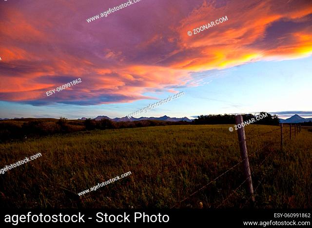 Sunset over ranch country and the Rocky Mountains in Southern Alberta, Canada