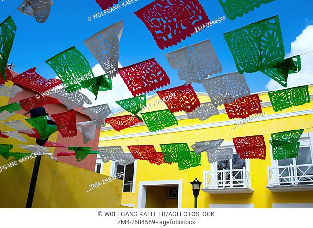 Mexican Papel Picado decorations over a street in San Miguel de Cozumel on Cozumel Island near Cancun in the state of Quintana Roo, Yucatan Peninsula, Mexico