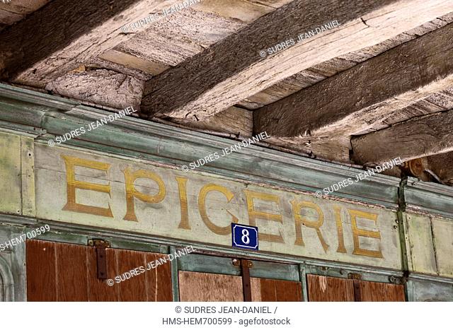 France, Gers, Saint Clar, retail storefront under the arcades of the town hall square