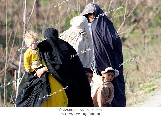 Heavily veiled women walk with their children in the Swat valley in Khwaza Khela, Pakistan, 07 March 2013. The valley is the main site where the Pakistani army...