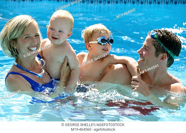 happy family in a swiming pool