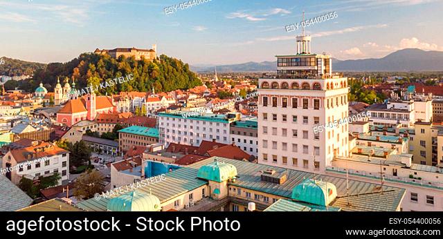 Aerial panoramic view of Ljubljana, capital of Slovenia in warm afternoon sun. Old skyscraper of Ljubljana with it's panoramic rooftop terrace dominating the...