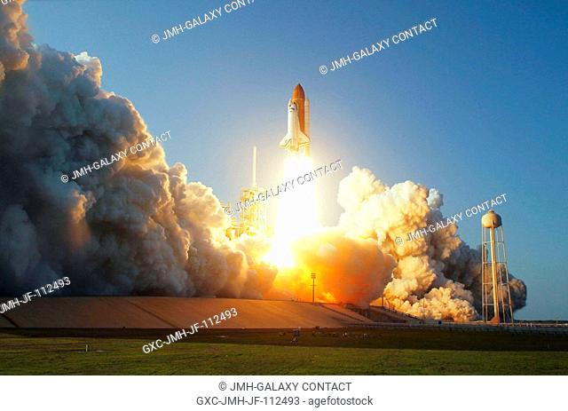 Space shuttle Discovery and its six-member STS-133 crew head toward Earth orbit and rendezvous with the International Space Station