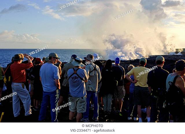 People watching lava flowing from Kilauea Volcano, Hawai'i Volcanoes National Park The Big Island Hawaii. - 01/01/2010