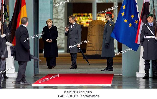 German Chancellor Angela Merkel (CDU, L, back) and German Foreign Minister Guido Westerwelle (FDP, R, back) wait for the arrival of Egyptian President Mohammed...
