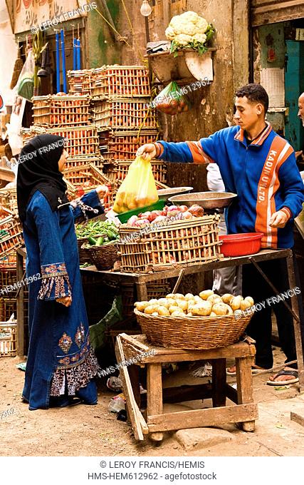 Egypt, Cairo, Khan El Khalili souk, selling vegetables
