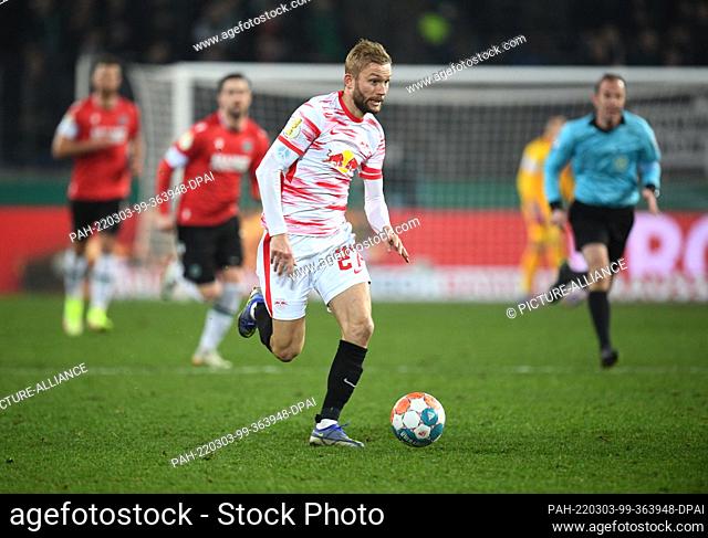 02 March 2022, Lower Saxony, Hanover: Soccer: DFB Cup, quarterfinals: Hannover 96 - RB Leipzig at the HDI Arena. Leipzig's Konrad Laimer plays the ball